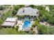 Stunning aerial view of the luxurious home with a sparkling pool, spa and lush landscaping at 16469 N 113Th Way, Scottsdale, AZ 85255
