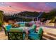 Scenic backyard showcasing a pool, patio, and mountain views at dusk at 16469 N 113Th Way, Scottsdale, AZ 85255