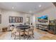 Spacious game room with poker table, tv, and an arcade game providing endless entertainment at 16469 N 113Th Way, Scottsdale, AZ 85255
