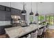 Gourmet kitchen with a center island, modern cabinetry, stainless steel appliances, and breakfast nook at 16469 N 113Th Way, Scottsdale, AZ 85255