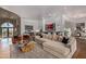 Spacious living room features stone archway, modern decor, and elegant furnishings at 16469 N 113Th Way, Scottsdale, AZ 85255