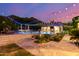 Stunning pool and patio area, beautifully illuminated at twilight at 16469 N 113Th Way, Scottsdale, AZ 85255