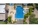 Aerial view of backyard pool with spa, lounge chairs, and lush landscaping at 16469 N 113Th Way, Scottsdale, AZ 85255