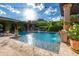 Picturesque pool with columned pergola, flowing fountain, and mountain views at 16469 N 113Th Way, Scottsdale, AZ 85255