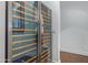 Modern wine refrigerator with glass door showcases the collection and adds sophistication to the space at 16469 N 113Th Way, Scottsdale, AZ 85255