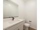 Bathroom featuring a large mirror, vanity with sink, and a toilet at 17250 W Via Dona Rd, Surprise, AZ 85387