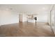 Spacious living room featuring an open concept design and wood-look floors at 17250 W Via Dona Rd, Surprise, AZ 85387