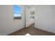 Bright bedroom featuring hardwood floors, a window, and neutral paint at 17319 W Via Dona Rd, Surprise, AZ 85387
