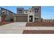 Contemporary two-story home with a two-car garage and desert landscaping at 17319 W Via Dona Rd, Surprise, AZ 85387