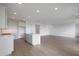 Bright kitchen with a center island, hardwood floors, and ample space at 17319 W Via Dona Rd, Surprise, AZ 85387
