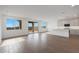 Open concept living room with hardwood floors, recessed lighting, and a view of the kitchen at 17319 W Via Dona Rd, Surprise, AZ 85387