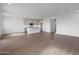 Bright and open living area with hardwood floors and recessed lighting at 17319 W Via Dona Rd, Surprise, AZ 85387
