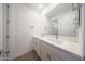 Stylish bathroom features double sinks, white countertops, and a large mirror at 17429 W Via Dona Rd, Surprise, AZ 85387