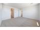 Neutral bedroom with multiple entry ways and ample space for furniture and relaxing at 17429 W Via Dona Rd, Surprise, AZ 85387