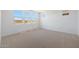 Bright bedroom with large windows providing ample natural light and neutral carpet at 17429 W Via Dona Rd, Surprise, AZ 85387