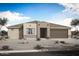 Stylish single-story home featuring a contemporary design and a low-maintenance desert landscape at 17429 W Via Dona Rd, Surprise, AZ 85387