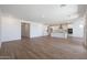 Bright and airy living space with an open floor plan connecting the kitchen and living areas at 17429 W Via Dona Rd, Surprise, AZ 85387
