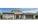 Stylish single-Gathering home featuring stone accents, neutral colors, and a well-manicured front yard at 17560 W Crawfordsville Dr, Surprise, AZ 85388