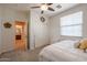 Bedroom showcasing carpet floors, natural lighting, and a closet space at 17981 W Agave Rd, Goodyear, AZ 85338