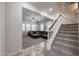 Open living area with stairs and view to adjacent seating area at 17981 W Agave Rd, Goodyear, AZ 85338