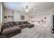 Cozy loft area with plush carpet, ceiling fan, and access to other rooms upstairs at 17981 W Agave Rd, Goodyear, AZ 85338
