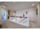 Carpeted upstairs loft area with lots of light and an office space at 17981 W Agave Rd, Goodyear, AZ 85338