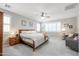 Spacious main bedroom with a ceiling fan, ample natural light, and comfortable furnishings at 17981 W Agave Rd, Goodyear, AZ 85338