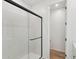 Bathroom featuring an enclosed walk-in shower and tiled floors at 18256 W La Senda Dr, Surprise, AZ 85387