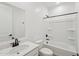 Bright bathroom with modern fixtures including a single sink and a shower-tub combo at 18256 W La Senda Dr, Surprise, AZ 85387
