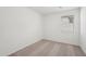 Bright bedroom featuring neutral carpet, walls, and a window with blinds at 18256 W La Senda Dr, Surprise, AZ 85387