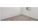 Bright bedroom with a neutral carpet and window with blinds at 18256 W La Senda Dr, Surprise, AZ 85387