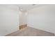 Bedroom featuring neutral walls, carpet, and an open doorway to another room at 18256 W La Senda Dr, Surprise, AZ 85387