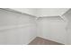 Walk-in closet featuring neutral colored carpet and ample hanging space at 18256 W La Senda Dr, Surprise, AZ 85387