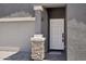 Home exterior showcasing a front door with stone column accents and a convenient attached two-car garage at 18256 W La Senda Dr, Surprise, AZ 85387