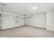 Spacious garage with an automatic door, high ceilings, and smooth concrete flooring at 18256 W La Senda Dr, Surprise, AZ 85387