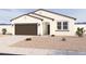 Charming single-story home boasts a well-manicured desert landscaped front yard and a two-car garage at 18261 W Camino De Oro --, Surprise, AZ 85387