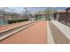 Bocce ball court featuring manicured landscaping and sheltered seating areas for friendly competition at 18272 W Camino De Oro --, Surprise, AZ 85387