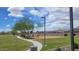 Community playground with swings, slides, and climbing structures, perfect for fun at 18272 W Camino De Oro --, Surprise, AZ 85387