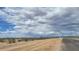 Newly constructed road in the community with landscaping and desert views at 18272 W Camino De Oro --, Surprise, AZ 85387