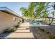 Spacious backyard featuring a lush lawn, mature trees, and a serene outdoor living space at 20 W Canterbury Ln, Phoenix, AZ 85023