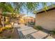 Beautiful backyard with a cozy seating area, lush greenery, and modern hardscape at 20 W Canterbury Ln, Phoenix, AZ 85023