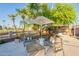 Relaxing backyard patio with comfortable seating, shade, and well-manicured landscaping at 20 W Canterbury Ln, Phoenix, AZ 85023