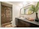 Chic bathroom featuring a walk-in shower and modern vanity at 20 W Canterbury Ln, Phoenix, AZ 85023