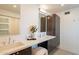 Modern bathroom featuring dual sinks, floating cabinets, and sleek fixtures at 20 W Canterbury Ln, Phoenix, AZ 85023