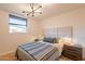 Serene bedroom features a padded headboard, modern lighting and neutral tones at 20 W Canterbury Ln, Phoenix, AZ 85023