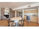 Cozy dining area with seating, fireplace and wine storage at 20 W Canterbury Ln, Phoenix, AZ 85023