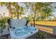 Relaxing hot tub with a view of the golf course, surrounded by mature landscaping at 20 W Canterbury Ln, Phoenix, AZ 85023