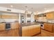 Modern kitchen with island, wine fridge, updated appliances and gorgeous cabinetry at 20 W Canterbury Ln, Phoenix, AZ 85023