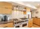 Stylish kitchen featuring stainless steel appliances, custom cabinetry, and a modern backsplash design at 20 W Canterbury Ln, Phoenix, AZ 85023