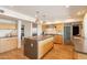 Contemporary kitchen featuring stainless steel appliances, a center island, and modern cabinetry at 20 W Canterbury Ln, Phoenix, AZ 85023